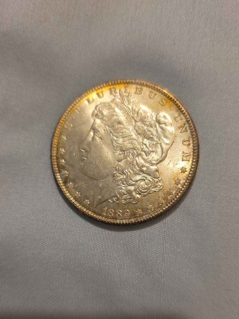 1889 Morgan Silver Dollar - Silver with Gold Toning